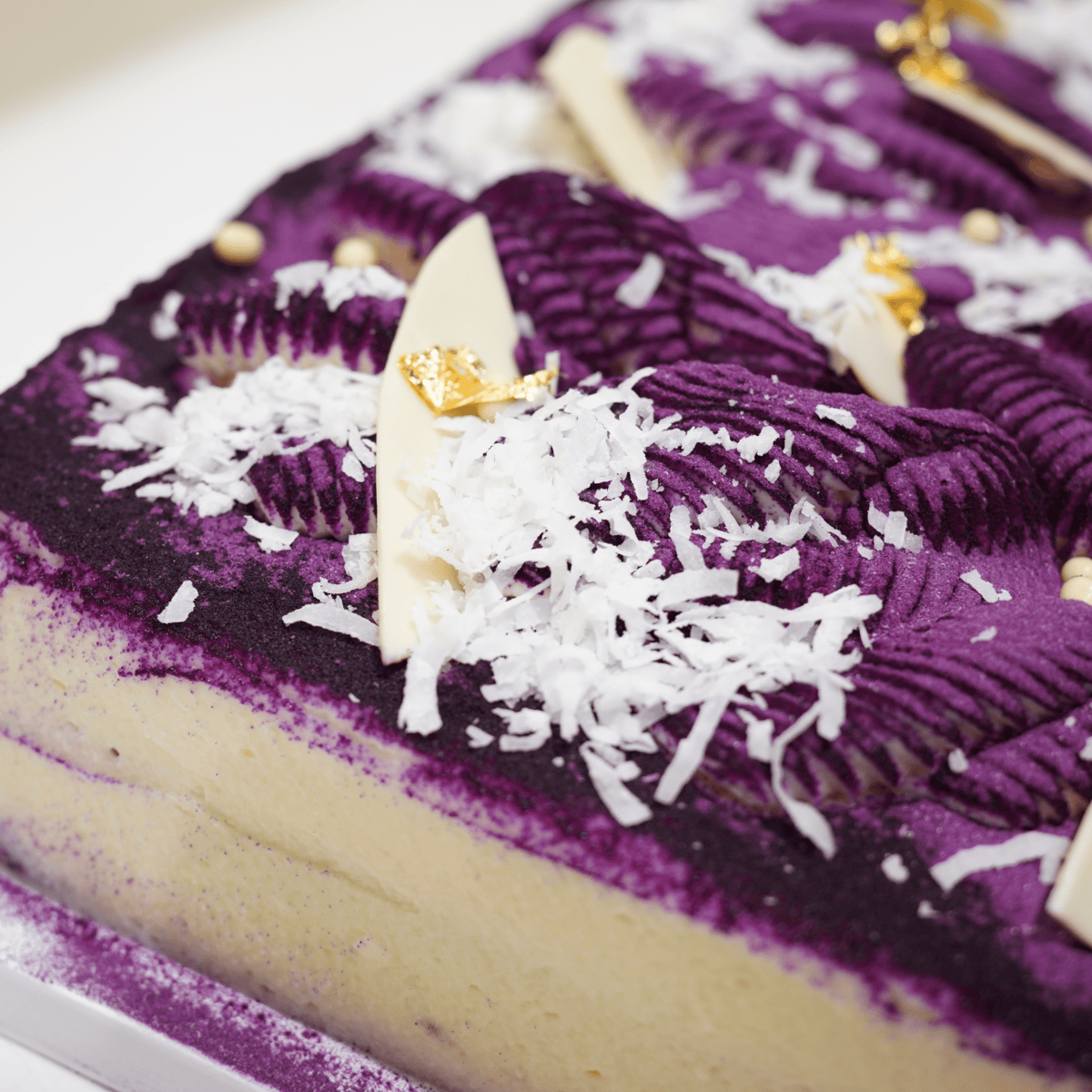 Closeup of a Ube Coconut Genoise Cake